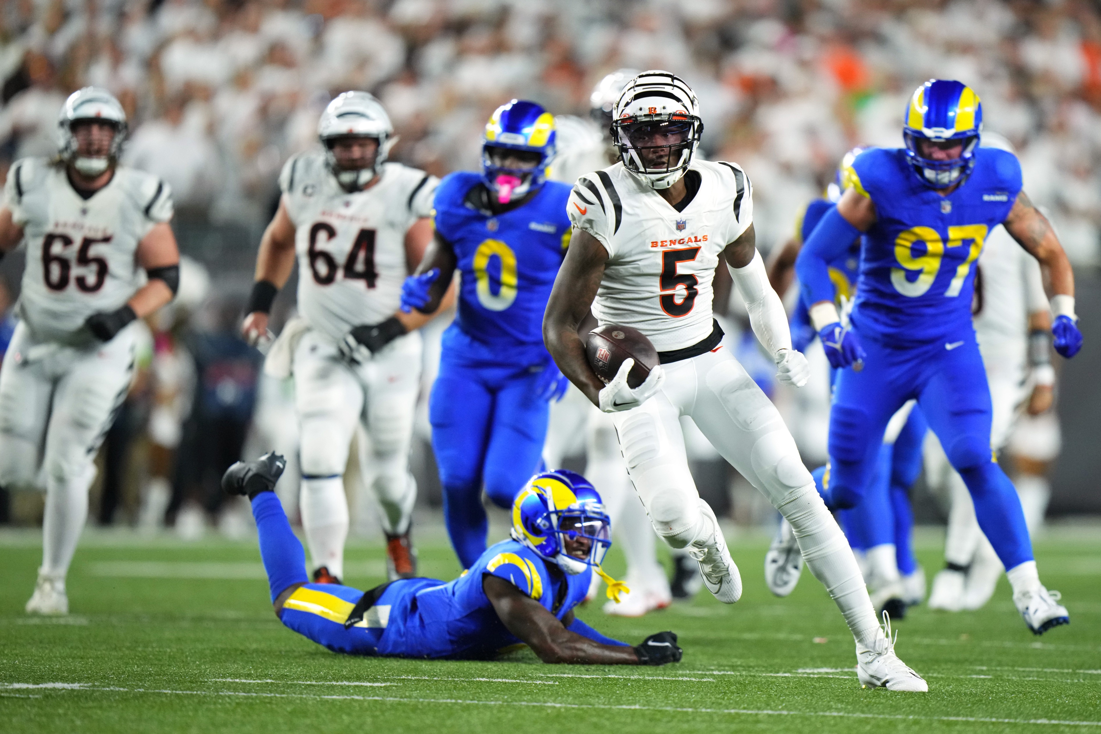 Cincinnati Bengals wide receiver Tee Higgins (5) runs downfield after a catch in the third quarter during a Week 3 NFL football game between the Los Angeles Rams and the Cincinnati Bengals, Monday, Sept. 25, 2023, at Paycor Stadium in Cincinnati. The Cincinnati Bengals won, 19-16.  